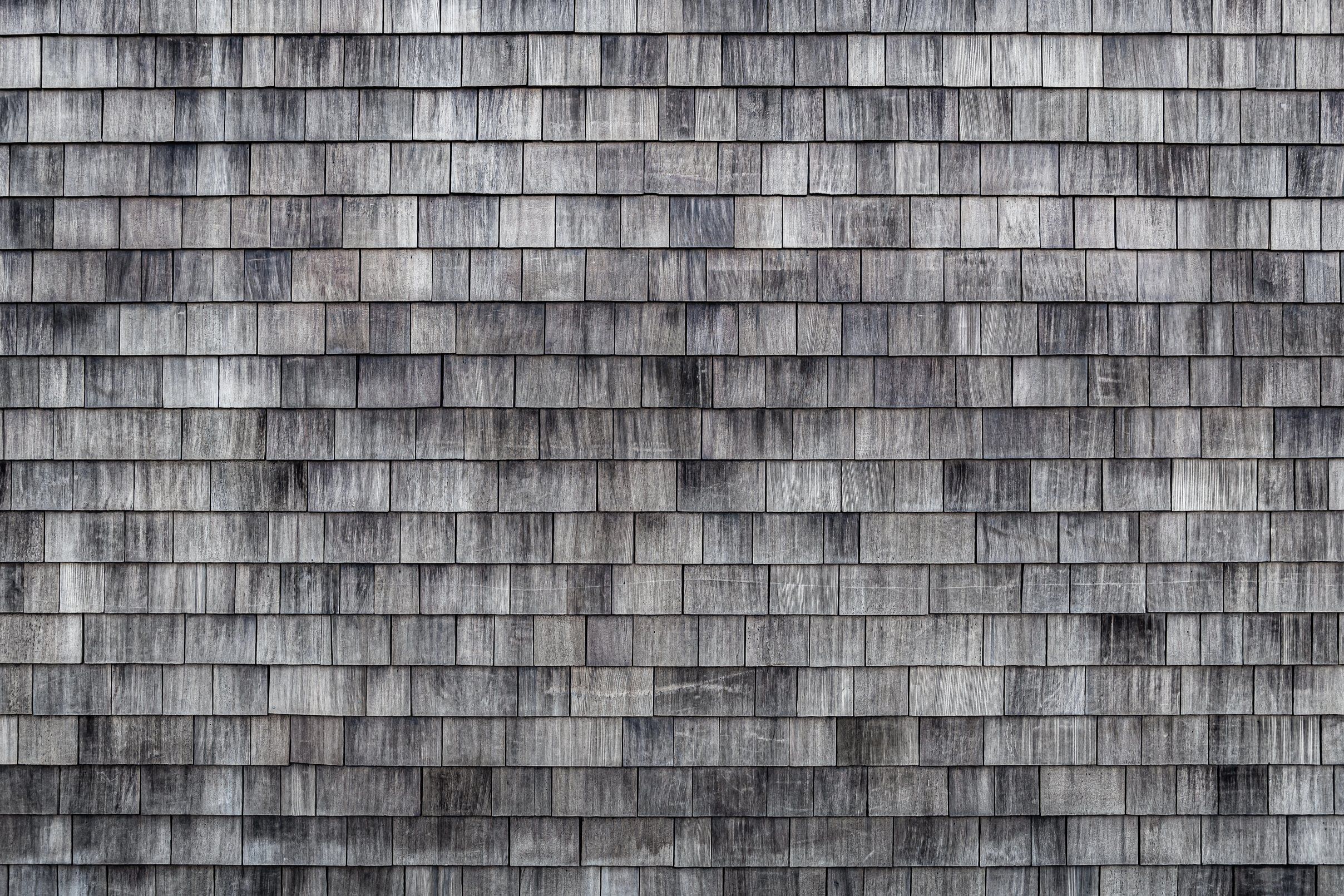 A wall of silvered cedar shingles.